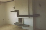 069 Зидана камина, проектирана и изпълнена през далечната 1993г в покрайнините на София. Облицовката е от тъмен гранит, апликиран с дървена греда.